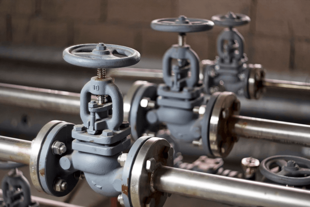 A group of metal valves in a factory.