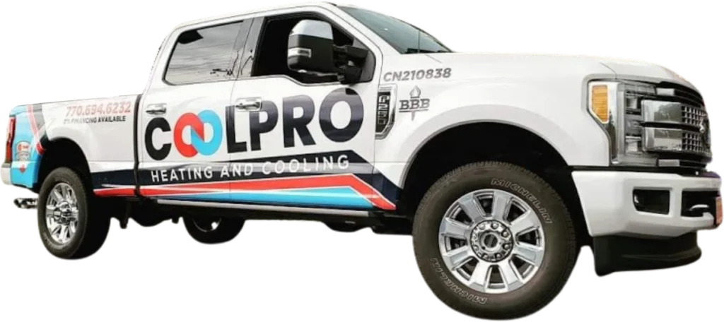 A white truck parked outside a home with the words Coolpro Heating and Cooling on it.