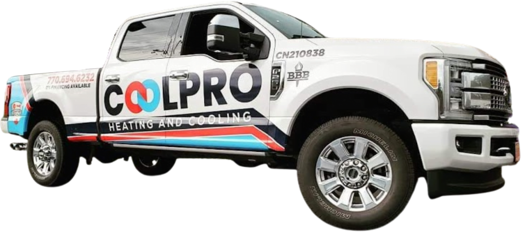 A white truck parked outside a home with the words Coolpro Heating and Cooling on it.