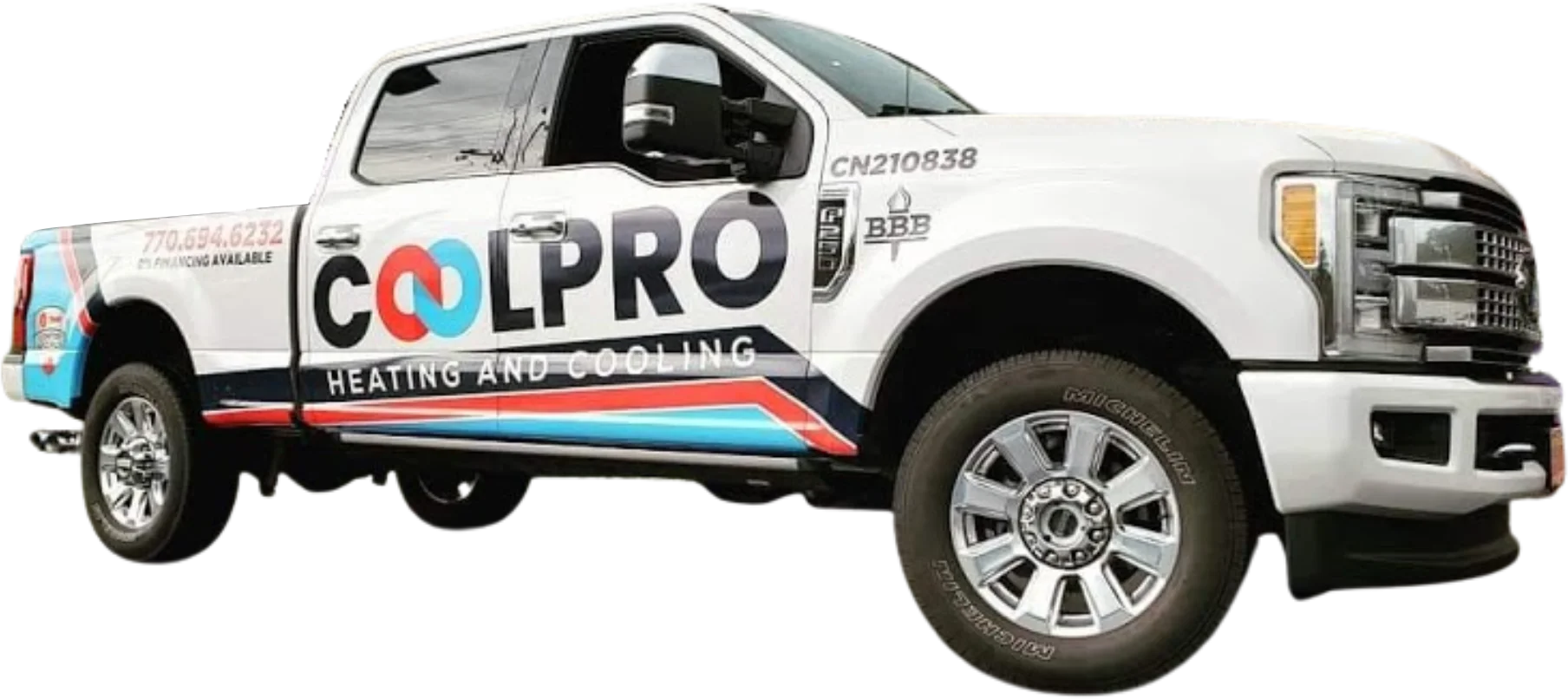 A white truck parked outside a home with the words Coolpro Heating and Cooling on it.