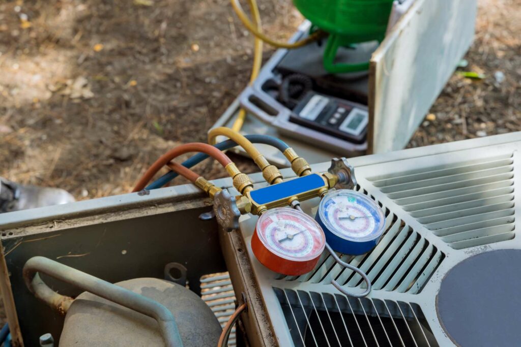 A commercial air conditioning unit with an attached gauge.