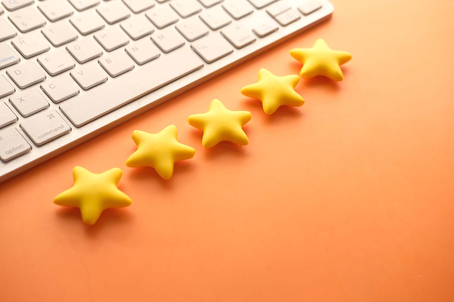 Five-star keyboard on an orange background.