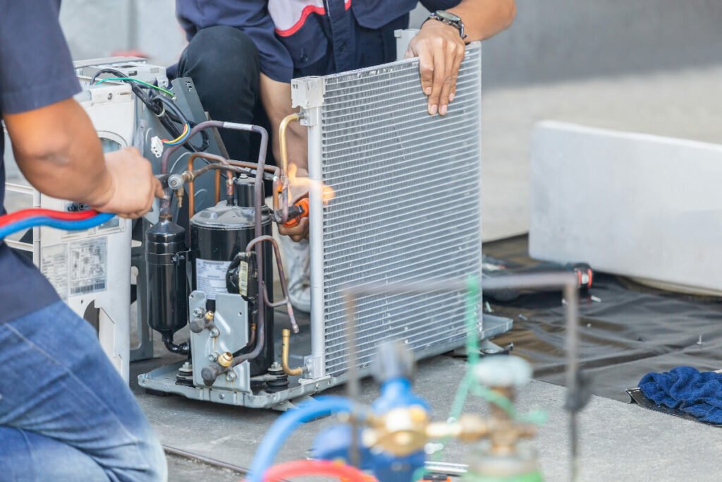 Two Coolpro technicians providing commercial hvac installation services.