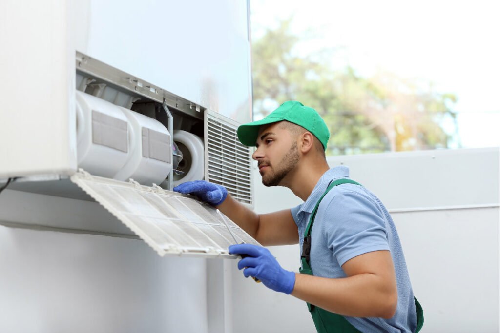 A Coolpro technician providing commercial hvac replacement services for an hvac unit.