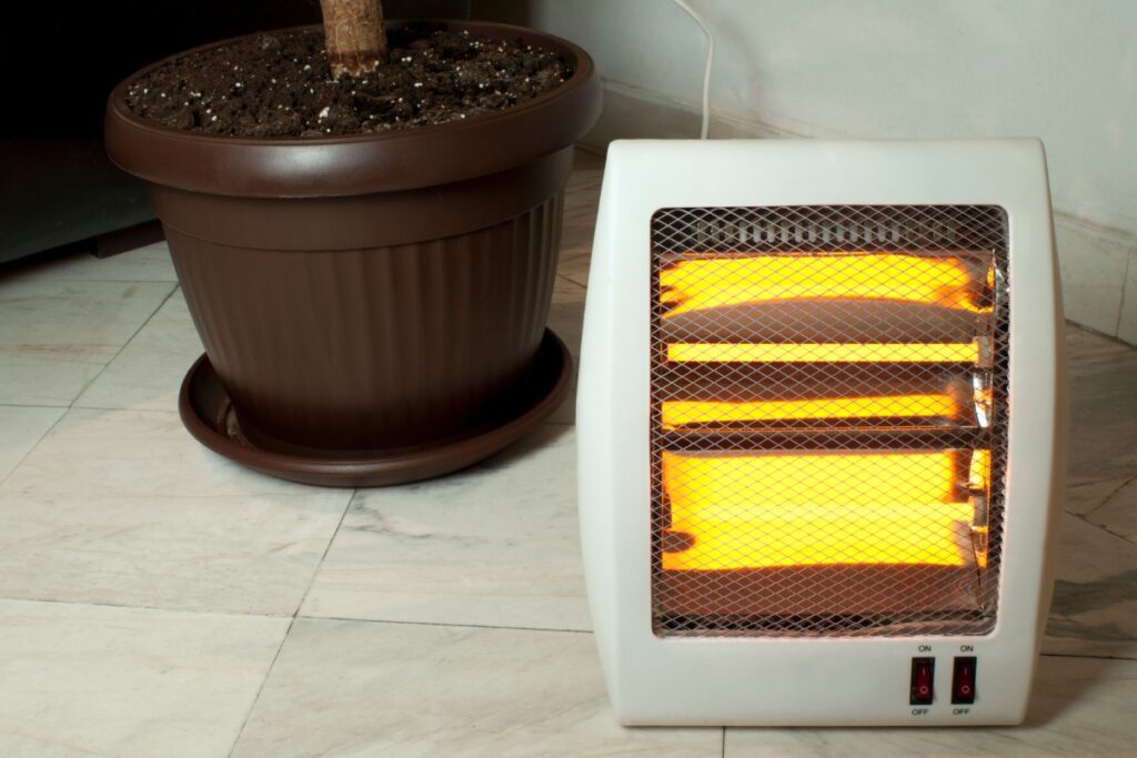 Space Heater next to a potted plant - Safety Tips.