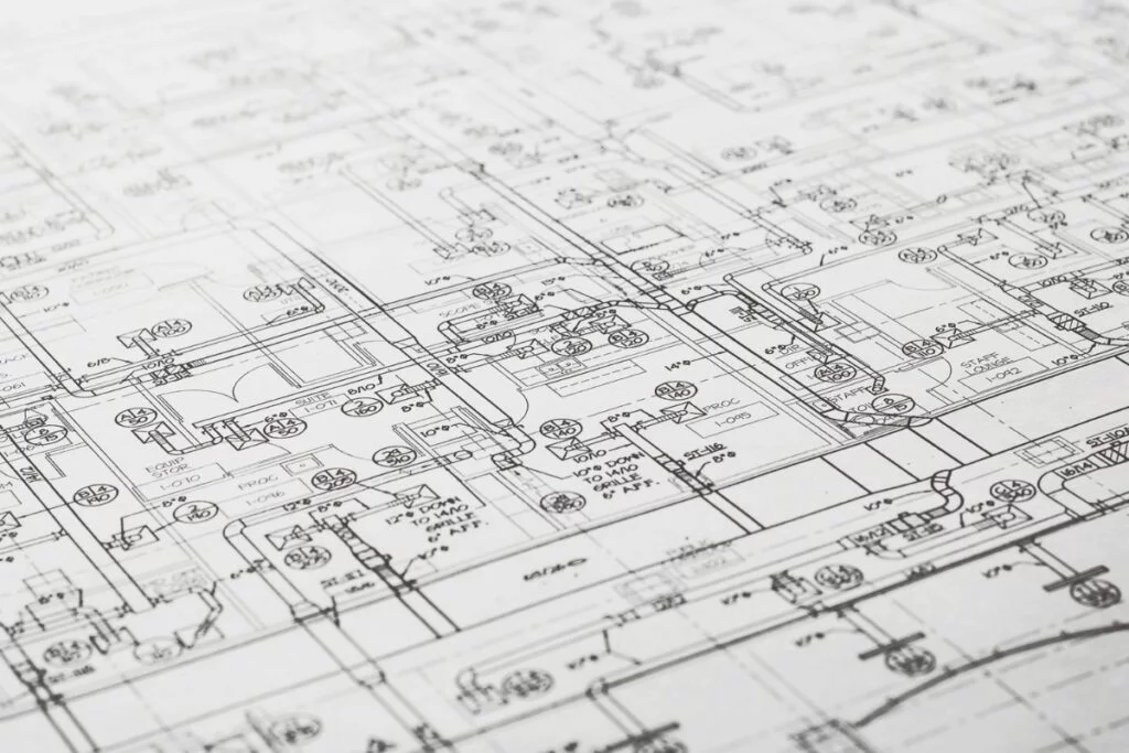 Detailed architectural blueprint featuring various technical drawings and schematics, including measurements, symbols, notes, and hvac planning.