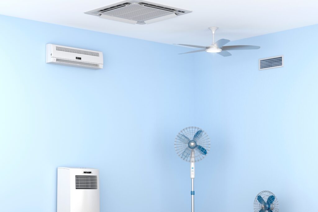 A room with light blue walls highlights an efficient HVAC planning setup, featuring a mounted air conditioner, a ceiling fan, a standing fan, a floor fan, and a ventilation grille.