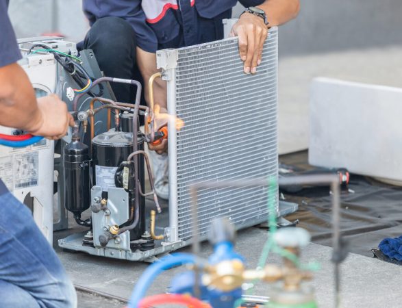 Two Coolpro technicians providing commercial hvac installation services. Two Coolpro technicians providing commercial hvac installation services.