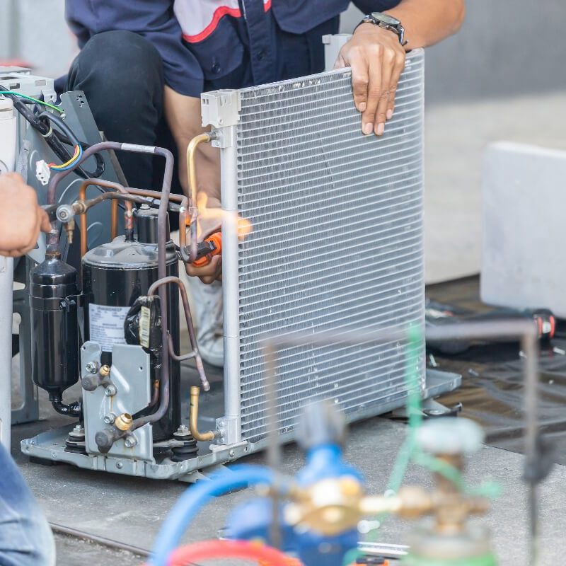 Two Coolpro technicians providing commercial hvac installation services.